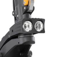 Close-up of dual front LED headlights on Ausom F1 Max Trottinette électrique electric scooter.