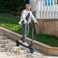 Man riding Ausom L1 Trottinette électrique electric scooter descending outdoor stairs with helmet and casual clothing